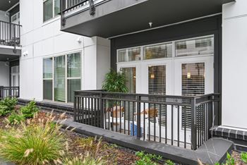 The front of a building with windows and a balcony